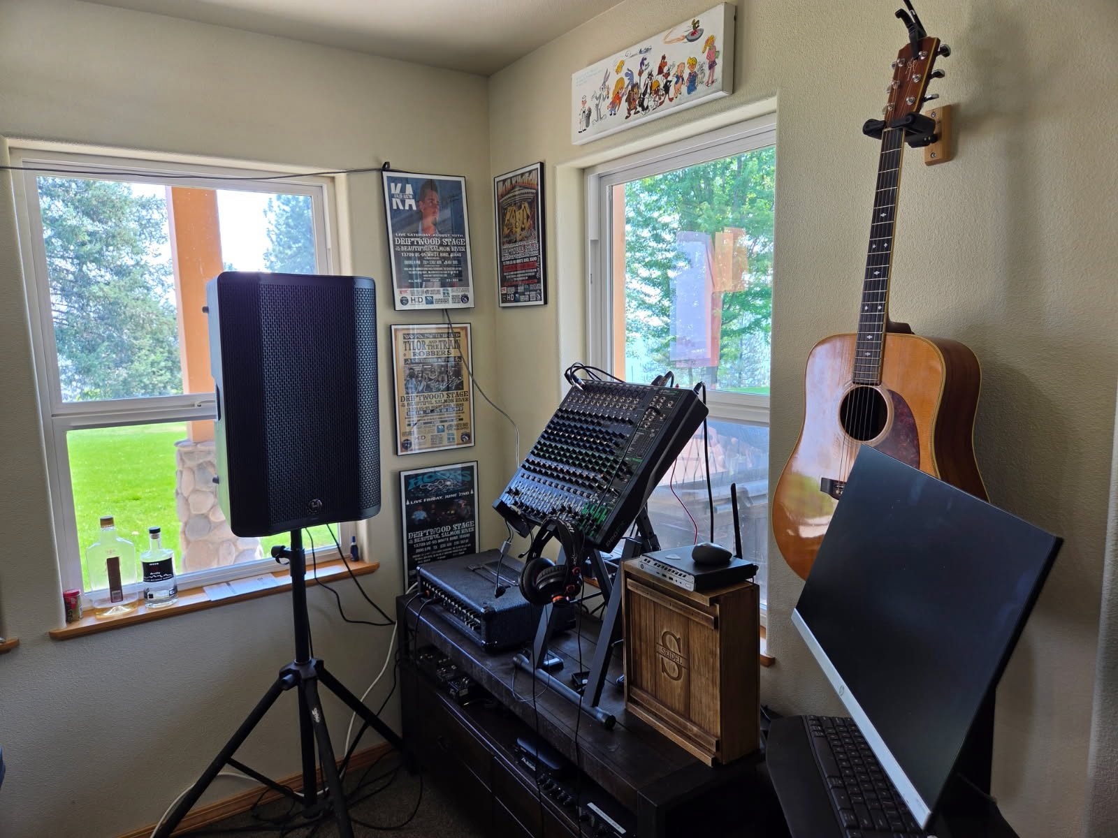 Tom's home music studio with Driftwood Stage posters and a guitar